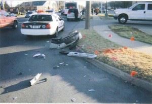 This photo shows some of the parts ripped off of our client’s car and the DART bus in the background.